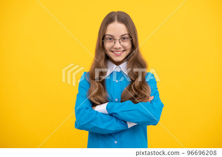 Confident teenage girl in eyeglasses happy smile keeping arms crossed blue background, confidence Confident teenage girl in eyeglasses happy smile keeping arms crossed blue background, confidence 96696208
