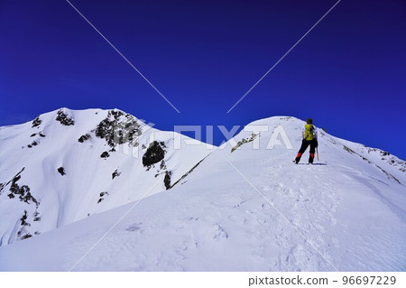Climbers climbing the ridgeline of Mt. Jonen in winter 96697229