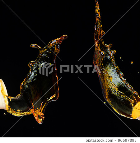 Orange, lemon juice or oil lubricant splash, liquid gold yellow drink drops. Fruit beverage water elements in line form . Fresh splashing and flowing jets, black background isolated freeze motion 96697895