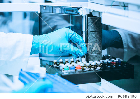 Pharmacist making medicines in the laboratory, pharmacy production concept 96698496
