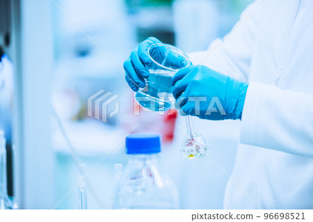 Pharmacist making medicines in the laboratory, pharmacy production concept Pharmacist making medicines in the laboratory, pharmacy production concept 96698521