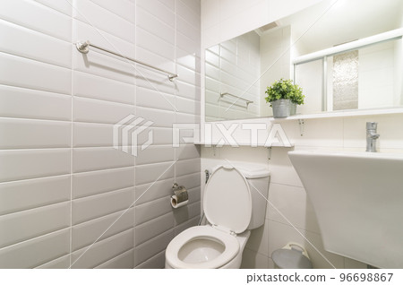 Loft white tile bathroom corner, tub and sink 96698867
