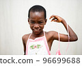 portrait of smiling little boy wearing colorful apron on white background 96699688