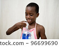 little boy playing with bottle of liquid soap 96699690