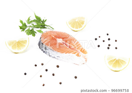 Salmon, slice of fresh raw fish with lemon slices, parsley and black pepper, isolated on white background 96699758