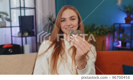 Woman stock trader earning bitcoins after online monitoring trading operations mining hold BTC coins Woman stock trader earning bitcoins after online monitoring trading operations mining hold BTC coins 96700458