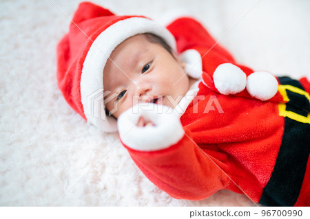 2 month old baby dressed as santa for christmas 96700990