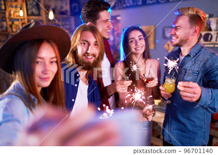 Selfie Time.Young Group of Friends Partying In A Nightclub And Toasting Drinks. Happy Young People. 96701140