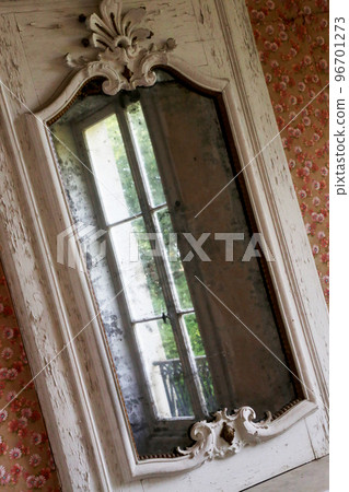Beautiful wooden frame mirror in old building without people Beautiful wooden frame mirror in old building without people 96701273