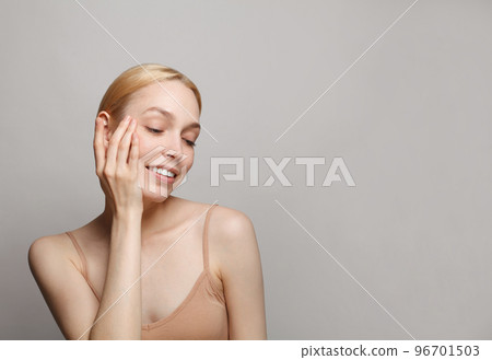 Female face closeup studio portrait. Young attractive woman spa wellness model on white background.  96701503