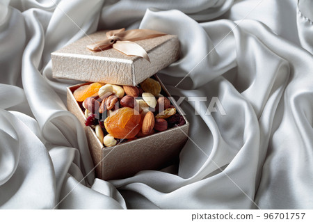 Dried fruits and nuts in a gift box. Dried fruits and nuts in a gift box. 96701757