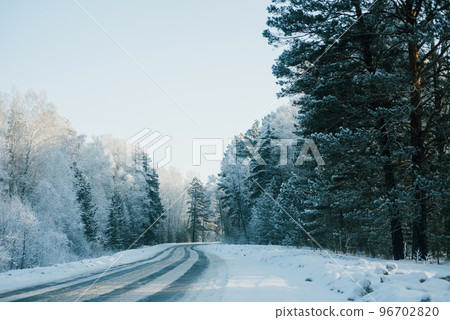Winter landscape, Winter forest road and trees, pine trees frosty day on the forest road Winter landscape, Winter forest road and trees, pine trees frosty day on the forest road 96702820