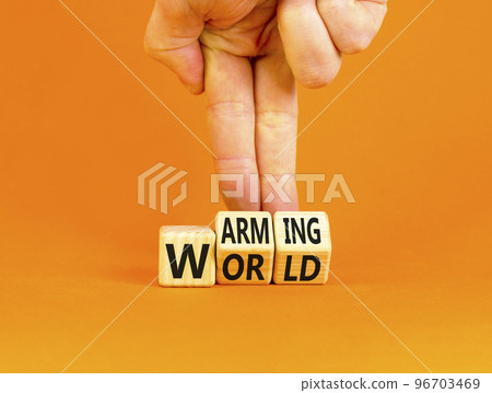 Warming world symbol. Concept words Warming world on wooden cubes. Beautiful orange table orange background. Businessman hand. Business, ecological and warming world concept. Copy space. 96703469