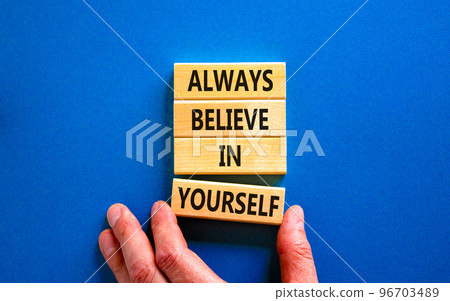 Always believe in yourself symbol. Concept words Always believe in yourself on wooden blocks on beautiful blue background. Businessman hand. Business motivational always believe in yourself concept. Always believe in yourself symbol. Concept words Always believe in yourself on wooden blocks on beautiful blue background. Businessman hand. Business motivational always believe in yourself concept. 96703489