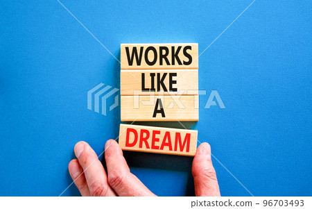 Works like a dream symbol. Concept words Works like a dream on wooden cubes. Beautiful blue table blue background. Businessman hand. Business motivational works like a dream concept. Copy space. Works like a dream symbol. Concept words Works like a dream on wooden cubes. Beautiful blue table blue background. Businessman hand. Business motivational works like a dream concept. Copy space. 96703493
