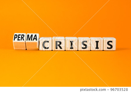 Permacrisis or crisis symbol. Concept words Crisis and Permacrisis on wooden cubes. Beautiful orange table orange background. Business permacrisis or crisis concept. Copy space. Permacrisis or crisis symbol. Concept words Crisis and Permacrisis on wooden cubes. Beautiful orange table orange background. Business permacrisis or crisis concept. Copy space. 96703528