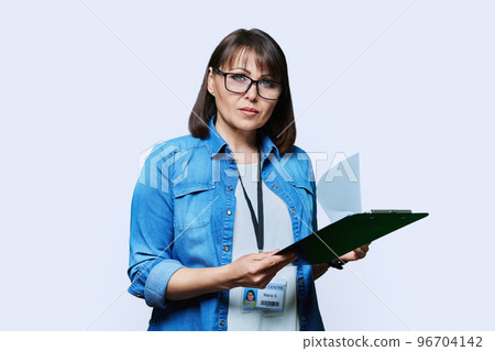 Portrait of woman worker with industrial center card clipboard, on white background Portrait of woman worker with industrial center card clipboard, on white background 96704142