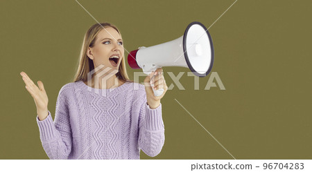 Beautiful young woman using loudspeaker announces special offer, shopping time, protest or meeting. 96704283