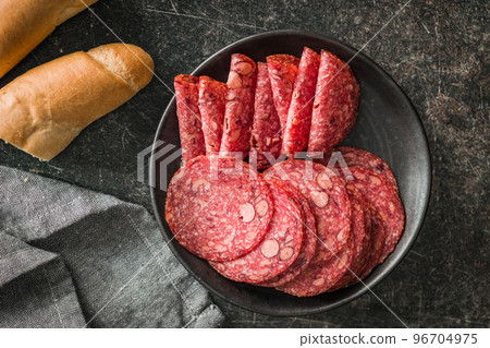 Sliced mexican salami with beans on plate. Top view. Sliced mexican salami with beans on plate. Top view. 96704975