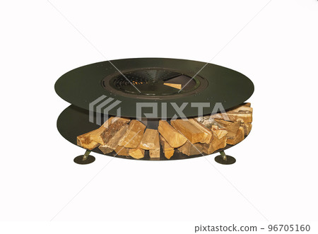 Huge round grill with firewood. Garden equipment for a picnic Huge round grill with firewood. Garden equipment for a picnic 96705160