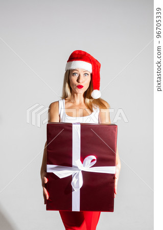 handsome woman with red and white christmas hat 96705339