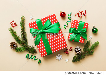 Top view Flat lay Christmas decorations and gift box on colored background with copy space. Christmas or Happy New Year composition 96705679