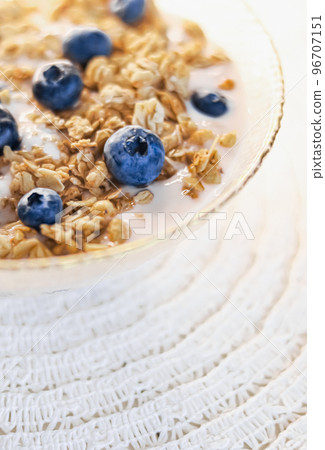 Breakfast idea and delicious food, breakfast cereal grains with lactose-free yoghurt and fresh organic blueberries in a bowl, tasty and healthy recipe, food photography Breakfast idea and delicious food, breakfast cereal grains with lactose-free yoghurt and fresh organic blueberries in a bowl, tasty and healthy recipe, food photography 96707151