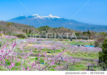 Chuo Main Line Shinpu Togenkyo ~Local train speeding against the backdrop of the remaining snow of Yatsugatake~ 96708366