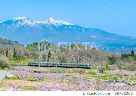 Chuo Main Line Shinpu Togenkyo ~Local train speeding against the backdrop of the remaining snow of Yatsugatake~ 96708368
