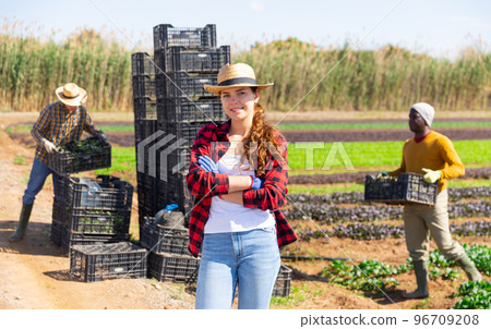 Portrait of woman farmer standing at the farm field 96709208