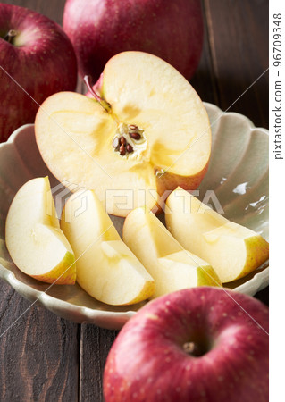 Sanfuji apples cut and served on a plate Sanfuji apples cut and served on a plate 96709348