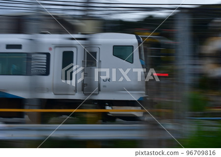 Tokaido Line panning shot Kamakura railroad crossing Tokaido Line panning shot Kamakura railroad crossing 96709816