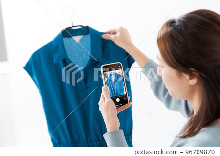 woman selling clothes woman selling clothes 96709870