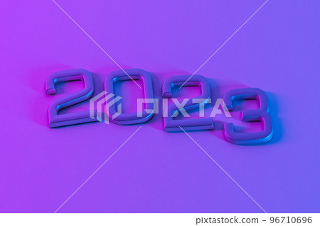 The numbers 2023 in neon light. New Year 2023 on a The numbers 2023 in neon light. New Year 2023 on a 96710696