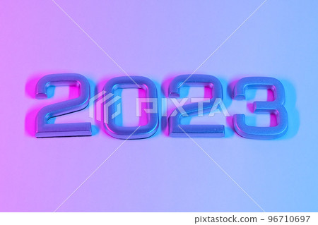 The numbers 2023 in neon light. New Year 2023 on a The numbers 2023 in neon light. New Year 2023 on a 96710697