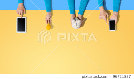 Technology devices and a piggy bank 96711887