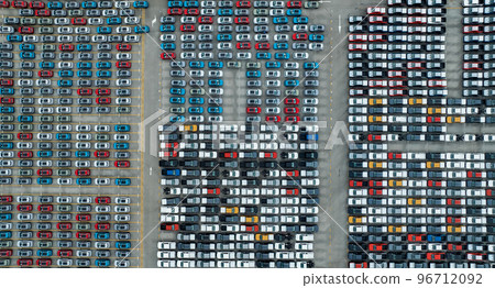 Aerial view of new cars stock at factory parking lot. Above view cars parked in a row. Automotive industry. Logistics business. Import or export new cars at warehouse. Big parking lot at port terminal 96712092
