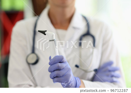 ENT woman doctor with diagnostic tools close-up. 96712287