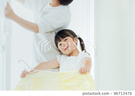 Girl helping with housework Girl helping with housework 96713478