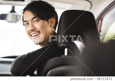 Image of a man who drives a car and a man who enjoys driving Image of a man who drives a car and a man who enjoys driving 96713871