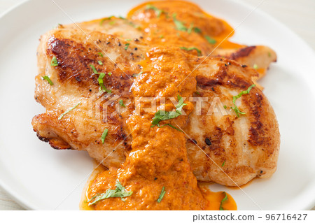 grilled chicken steak with red curry sauce 96716427