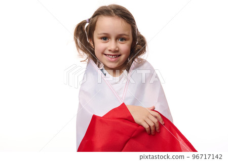 European Polish little citizen, a lovely child, baby girl wrapping flag of Poland, celebrates the Independence Day on November 11th, isolated over white background with copy space for promotional text European Polish little citizen, a lovely child, baby girl wrapping flag of Poland, celebrates the Independence Day on November 11th, isolated over white background with copy space for promotional text 96717142