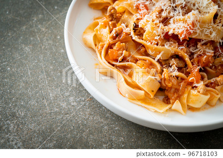 Homemade pasta fettuccine bolognese with cheese Homemade pasta fettuccine bolognese with cheese 96718103
