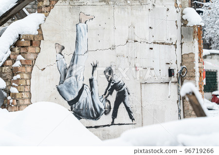 Wall of a destroyed building with Banksy graffiti in Borodyanka, Ukraine Wall of a destroyed building with Banksy graffiti in Borodyanka, Ukraine 96719266