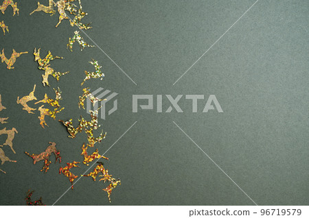 Christmas green background with shining reindeers. Flat lay mockup, top view copy space Christmas green background with shining reindeers. Flat lay mockup, top view copy space 96719579