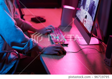 Cropped image of teenage boy playing shooter videogame at home 96719795