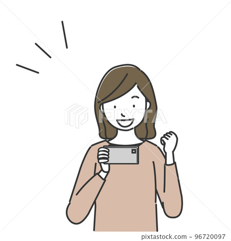 一個女人正在做膽量姿勢,看著智能手機屏幕 一個女人正在做膽量姿勢,看著智能手機屏幕 96720097