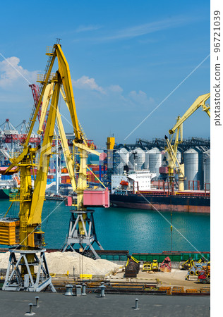 industrial seaport infrastructure, sea, cranes and dry cargo ship, grain silo, bulk carrier vessel and grain storage elevators, concept of sea cargo transportation industrial seaport infrastructure, sea, cranes and dry cargo ship, grain silo, bulk carrier vessel and grain storage elevators, concept of sea cargo transportation 96721039