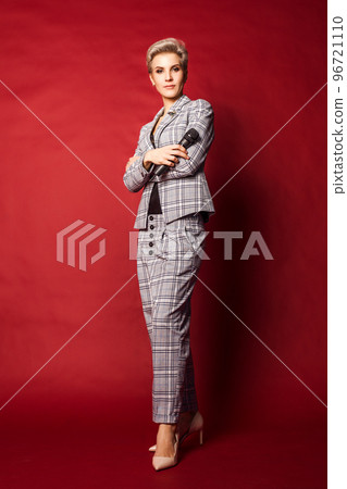 Beautiful blonde host singer blogger woman in suit Beautiful blonde host singer blogger woman in suit 96721110