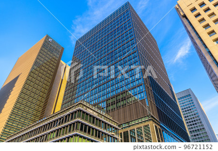 Tokyo cityscape in Japan View of the Japanese Bankers Association in Marunouchi. Buildings bathed in the setting sun and dyed orange Tokyo cityscape in Japan View of the Japanese Bankers Association in Marunouchi. Buildings bathed in the setting sun and dyed orange 96721152